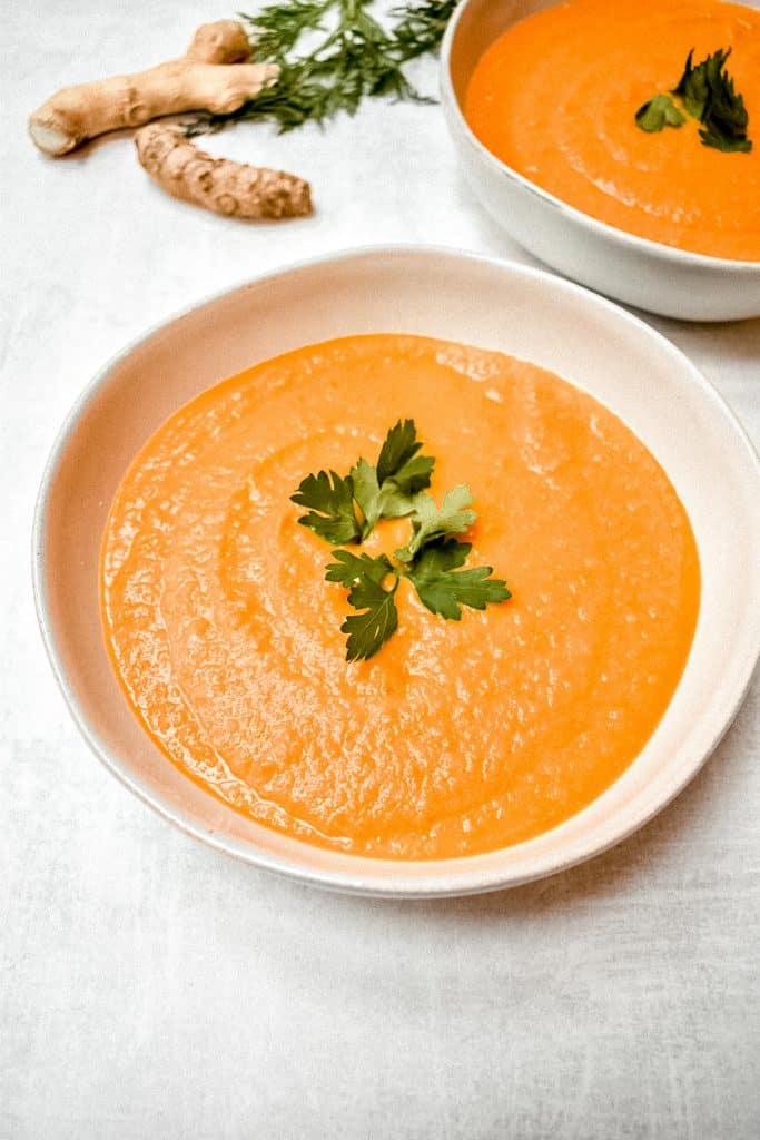 carrot ginger soup on orange background