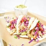 Smoky and slightly spicy chicken paired with creamy guacamole and a crunchy citrus slaw all nestled in a charred tortilla make these tacos a must for your weeknight dinner rotation or Cinco de Mayo celebrations.