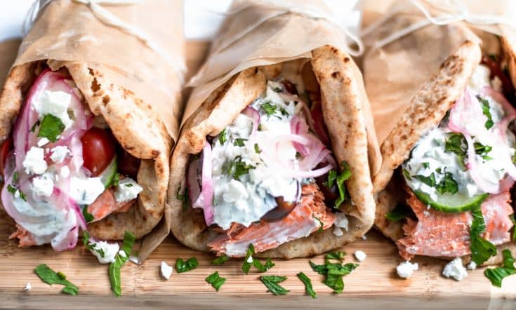 Greek salmon gyros with tzatziki and pickled onions